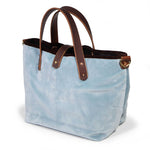 Luxe Velvet Mini Tote in glacier blue, three-quarter view, with brown velvet binding, mahogany leather handles and a brass D-ring