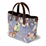 Aviary Luxe Velvet Mini Tote, three-quarter view showing the brown velvet binding and a brass D-ring at the side