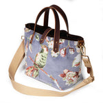 Aviary Luxe Velvet Mini Tote with a natural webbing crossbody strap clipped to its brass D-rings