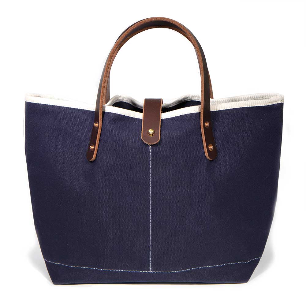 Navy waxed canvas mini tote with brown leather handles
