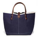 Navy waxed canvas mini tote with brown leather handles