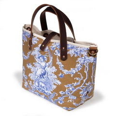 mini tote featuring oak and ink blue toile print with brown leather handles