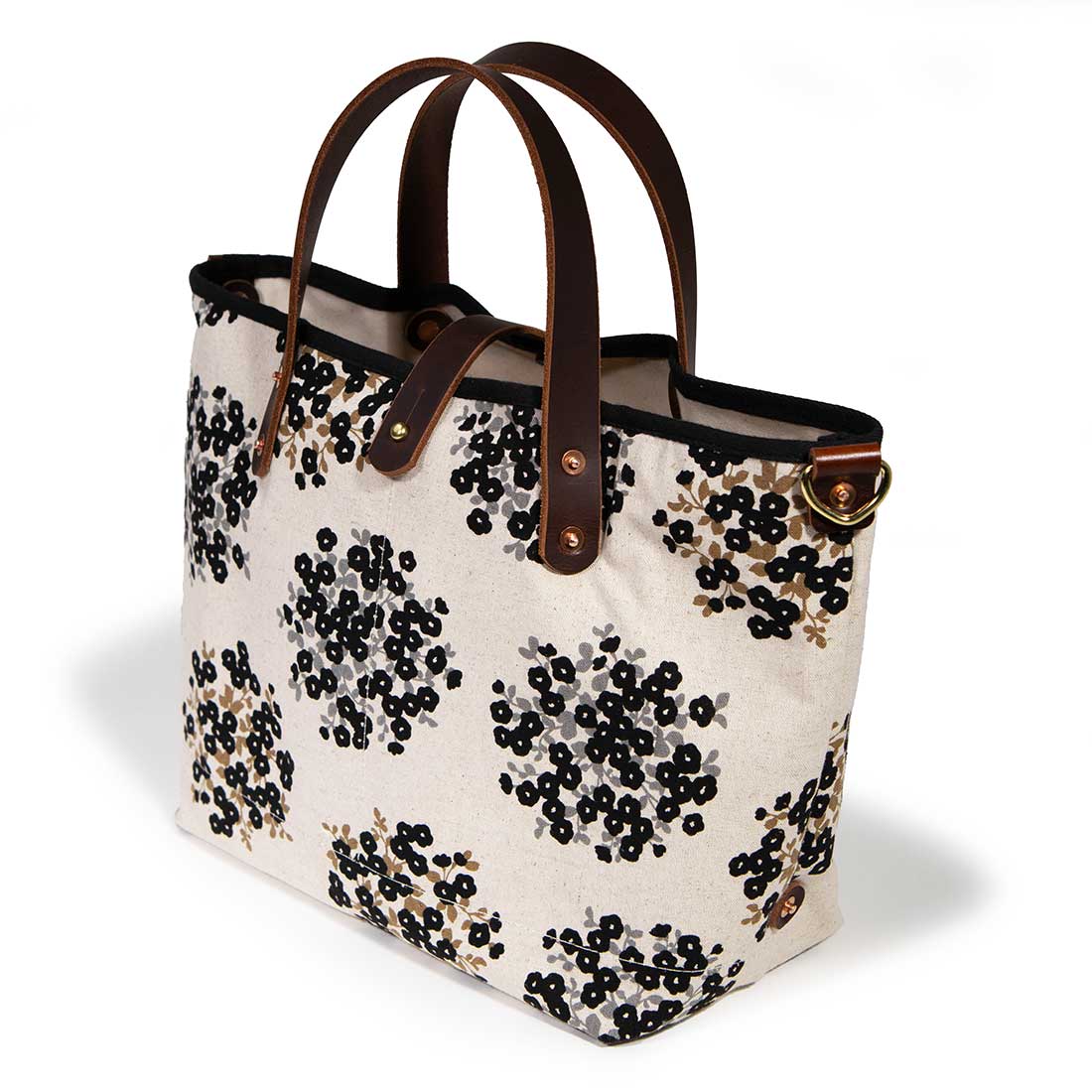 black and white floral mini tote with brown leather handles