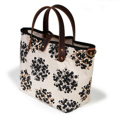 black and white floral mini tote with brown leather handles