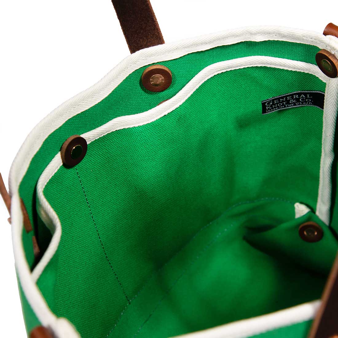 interior green canvas mini tote with brown leather handles