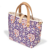 purple floral mini tote with blonde leather handles