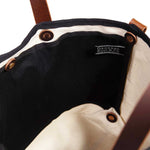 Interior black and white toile mini tote with brown leather handles