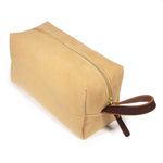 Camel Microsuede Travel Kit from the handle end, showing the mahogany leather loop handle and brass zipper