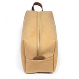 End view of the Camel Microsuede Travel Kit with the mahogany logo leather tab and brass zipper
