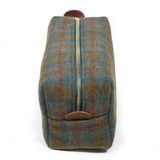 Top view of the Oxford Wool Check Travel Kit showing the brass YKK zipper and leather logo tab
