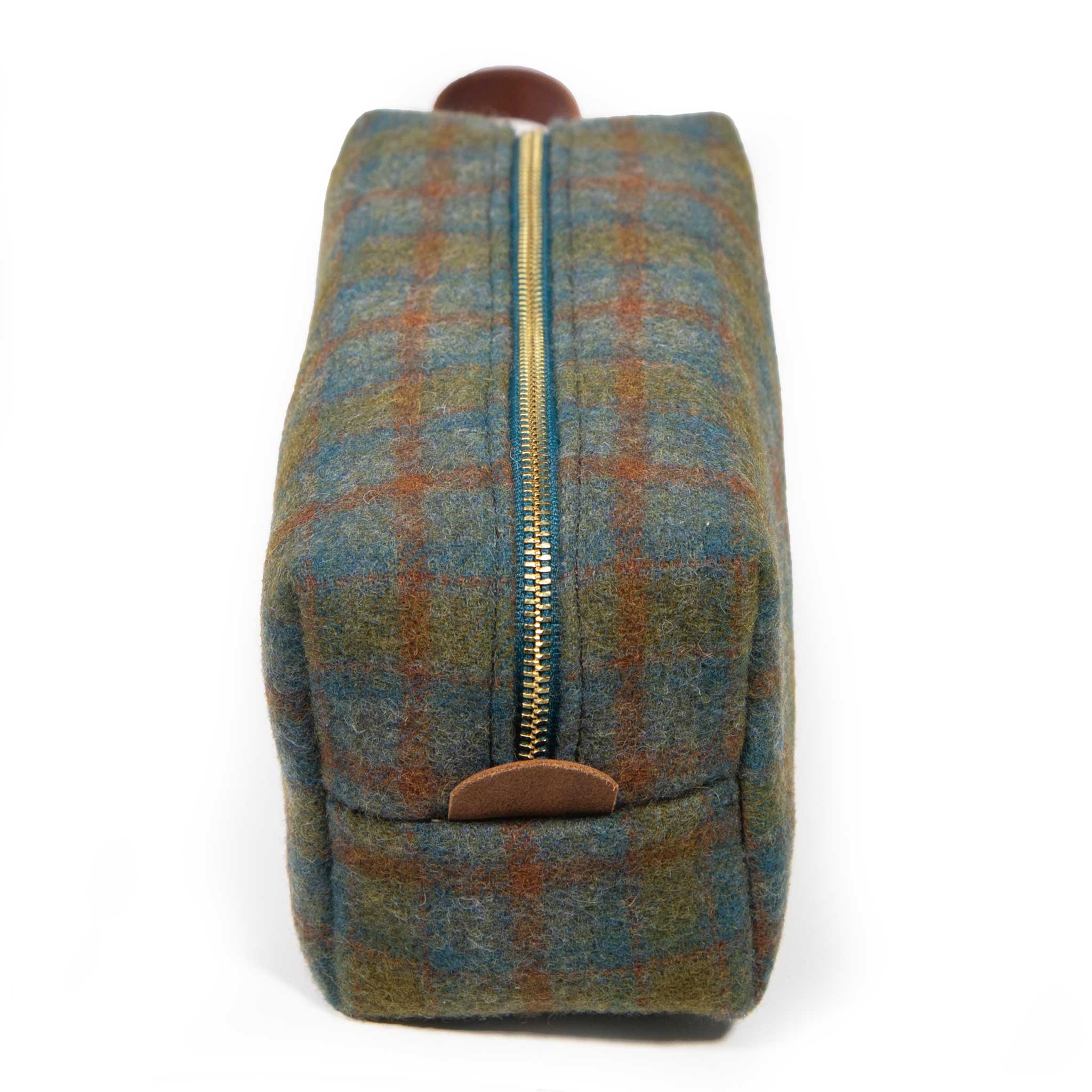 Top view of the Oxford Wool Check Travel Kit showing the brass YKK zipper and leather logo tab