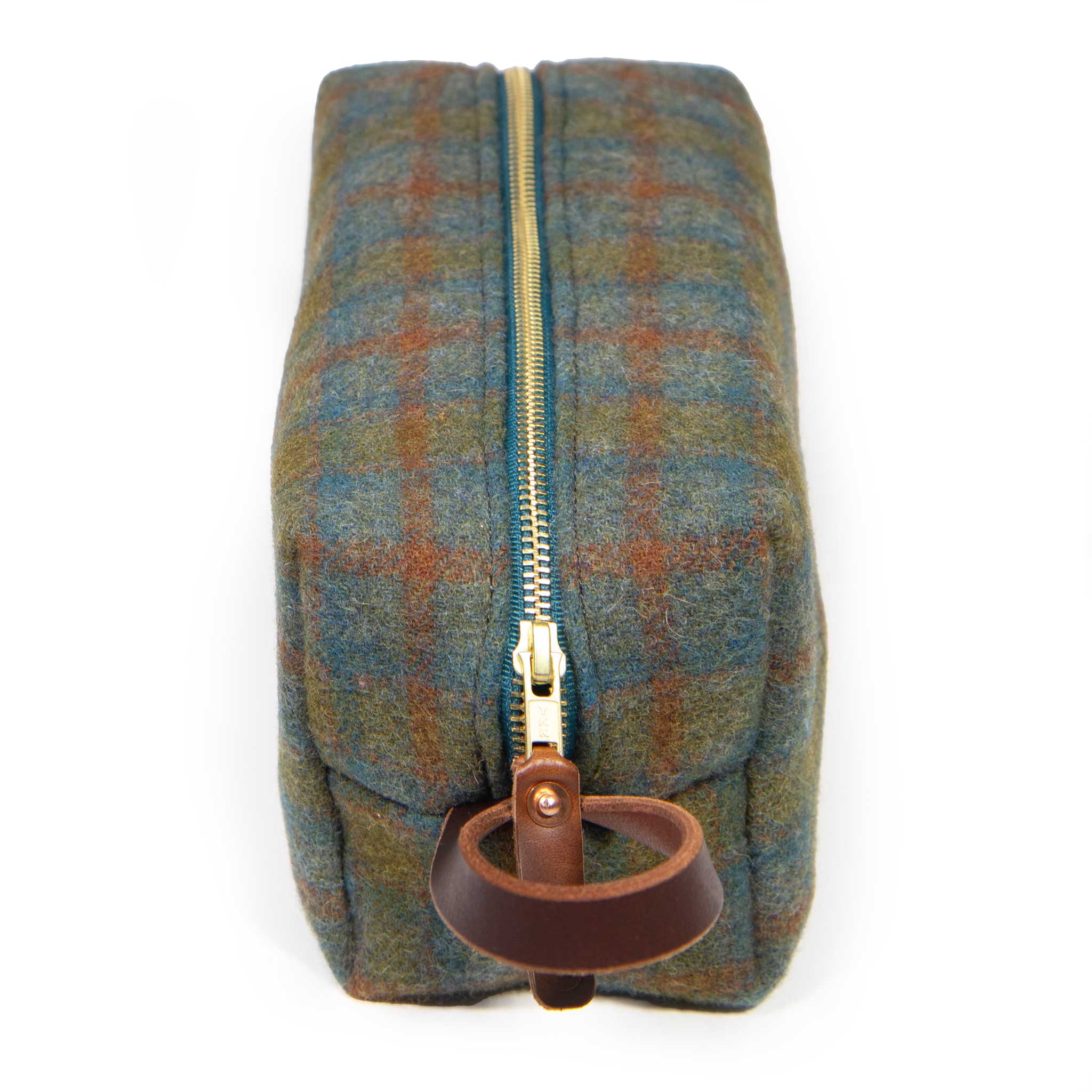 End view of the Oxford Wool Check Travel Kit with mahogany leather zipper pull on a brass YKK zipper