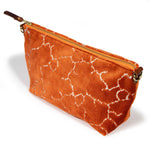 orange crackle velvet clutch with brown leather d-ring holders