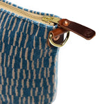 detail blue and white stripe velvet clutch with brown leather d-ring holders