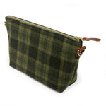 Everyday Wool Clutch in Moss Check, three-quarter view of the green wool plaid with brass zipper and leather pull