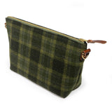 Everyday Wool Clutch in Moss Check, three-quarter view of the green wool plaid with brass zipper and leather pull