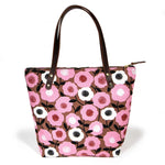 Soft pink floral tote with vintage midcentury-inspired print and brown leather handles