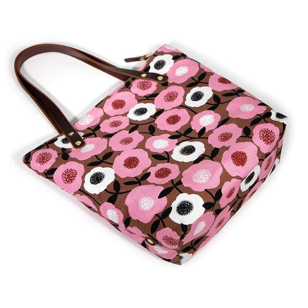 Soft pink floral tote with vintage midcentury-inspired print and brown leather handles