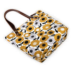Golden yellow midcentury-style floral canvas tote with brown leather straps
