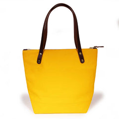 Yellow waxed canvas portfolio tote with brown leather handles