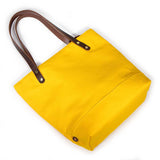 Yellow waxed canvas portfolio tote with brown leather handles
