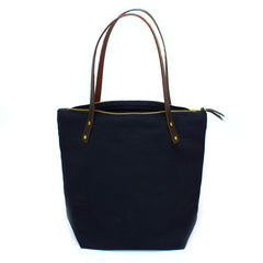 Navy waxed canvas portfolio tote with brown leather handles and zipper