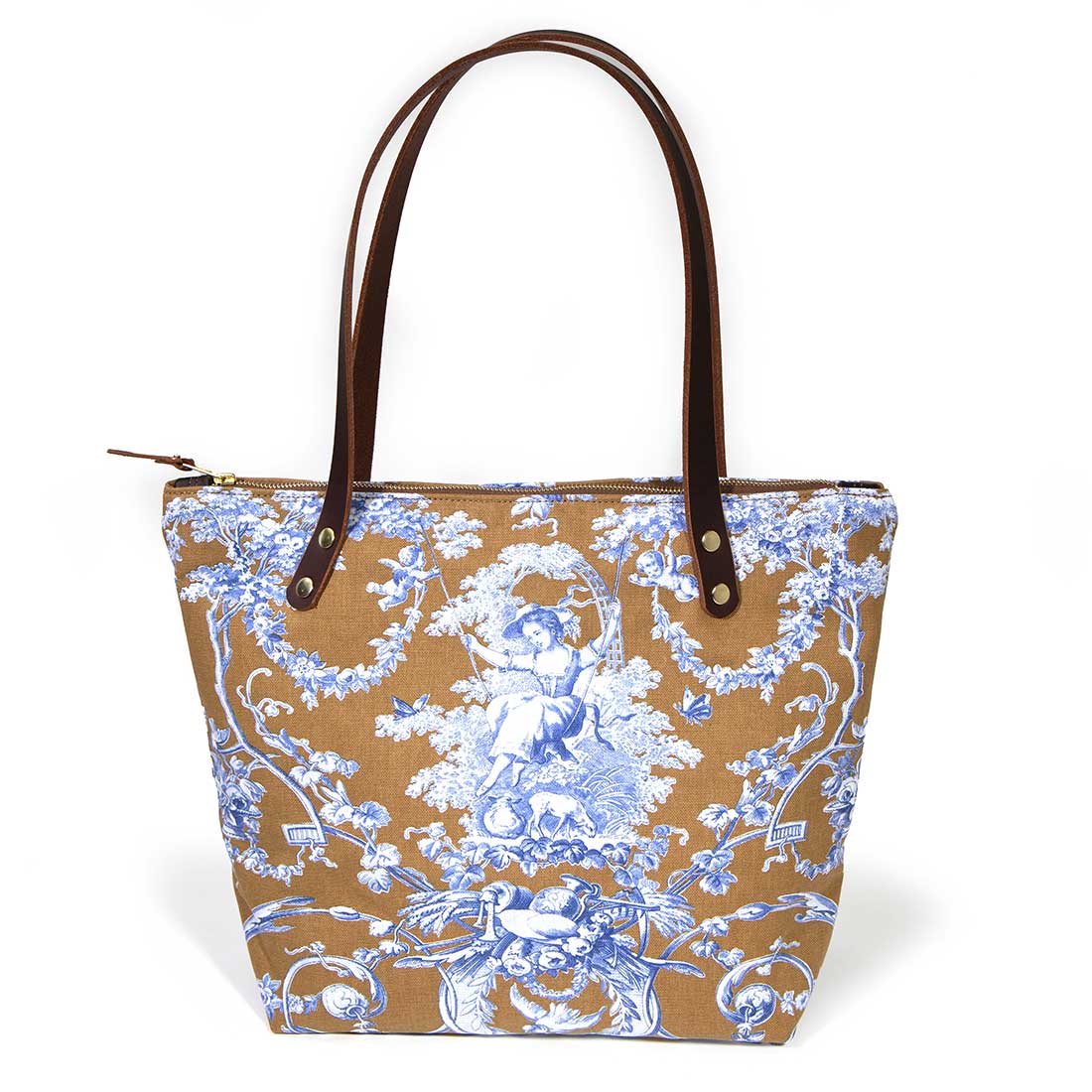 Portfolio tote featuring oak and ink blue toile print with brown leather handles and zipper