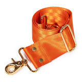 An orange satin strap with gold-tone hardware, including a lobster clasp, metal rings, and a rectangular buckle, shown on a plain white background.