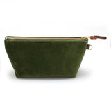 Front of the Olive Velvet Travel Clutch, olive green velvet, with brass zipper and mahogany leather pull