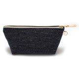 Front of the Indigo Chalk Stripe Travel Clutch, white chalk stripes on indigo, with brass zipper and blonde leather pull