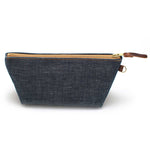 Front of the Japanese Denim Travel Clutch, indigo denim, with brass zipper and mahogany leather pull