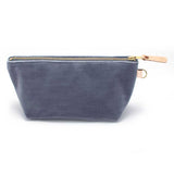 Front of the Cloudy Velvet Travel Clutch, blue-grey velvet, with brass zipper and blonde leather pull