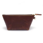 Front of the Mahogany Leather Travel Clutch, brown leather, with brass zipper and mahogany leather pull