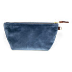 Front of the Wedgewood Blue Velvet Travel Clutch, Wedgewood blue velvet, with brass zipper and mahogany leather pull