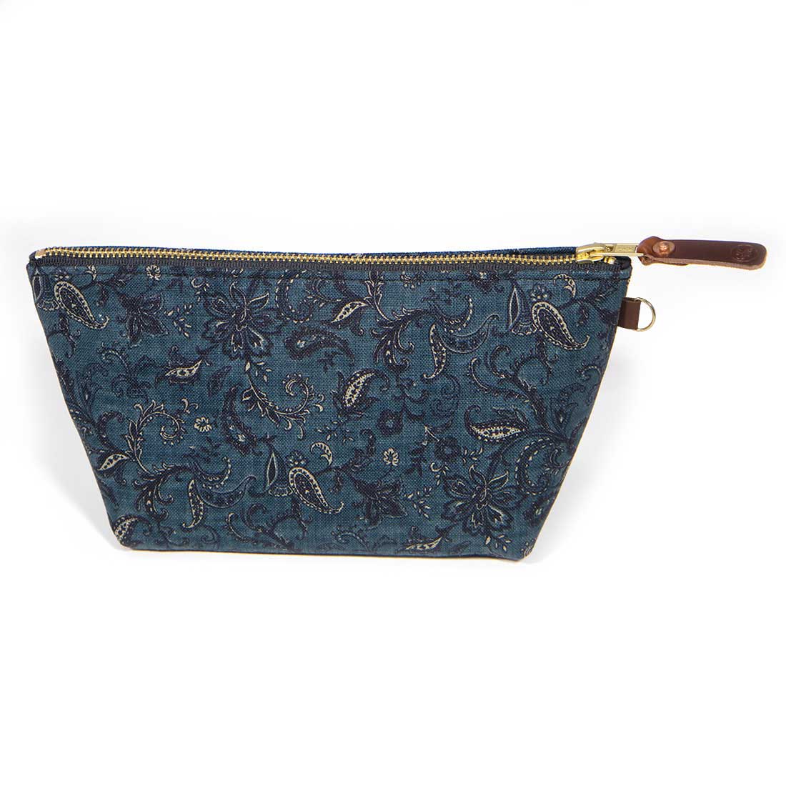 Front of the Dark Indigo Paisley Travel Clutch, dark indigo paisley, with brass zipper and mahogany leather pull