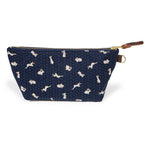 Front of the Nousagi Japanese Indigo Travel Clutch, cream rabbits on navy, with brass zipper and mahogany leather pull