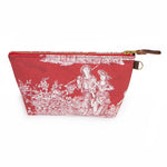 Front of the Scarlet Toile Travel Clutch, white toile scenes on scarlet, with brass zipper and mahogany leather pull