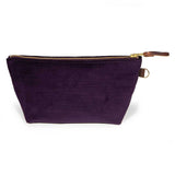Front of the Royal Purple Velvet Travel Clutch, royal purple velvet, with brass zipper and mahogany leather pull