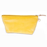Front of the Sunshine Velvet Travel Clutch, sunshine yellow velvet, with brass zipper and blonde leather pull