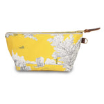 Front of the Sunshine Toile Travel Clutch, white toile scenes on yellow, with brass zipper and mahogany leather pull