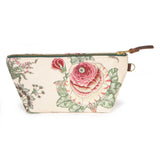 Front of the Botanique Floral Print Travel Clutch, a pink and deep rose cabbage rose with sage leaves, brass zipper and leather pull