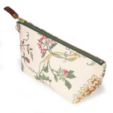 Reverse of the Botanique Floral Print Travel Clutch, with pink blossoms and a gold chrysanthemum on trailing yellow stems