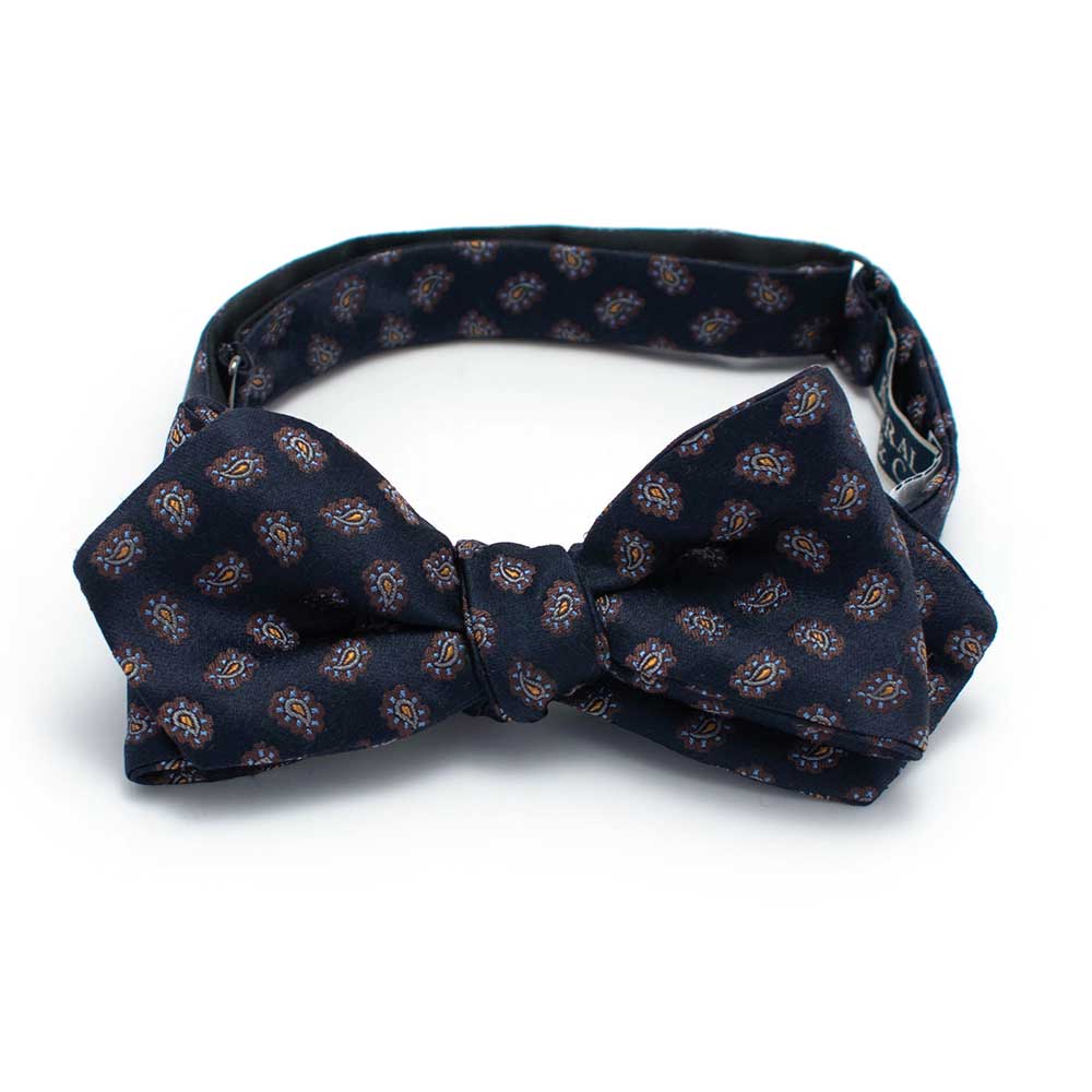 General Knot & Co. Self-Tied Diamond Point Bow 2.5" at widest 2.5" W- adjustable band 13.5" - 18.5" / Navy Navy Silk Paisley Bow