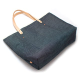Indigo blue tote made from Japanese denim with blonde leather straps