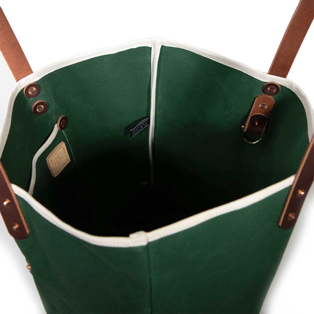 Interior Dark green waxed canvas tote bag with contrast stitching and brown leather handles