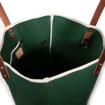 Interior Dark green waxed canvas tote bag with contrast stitching and brown leather handles