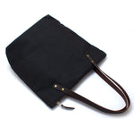 Black waxed canvas portfolio tote with brown leather handles