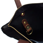 Interior Black waxed canvas portfolio tote with brown leather handles