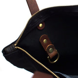 Interior Black waxed canvas portfolio tote with brown leather handles